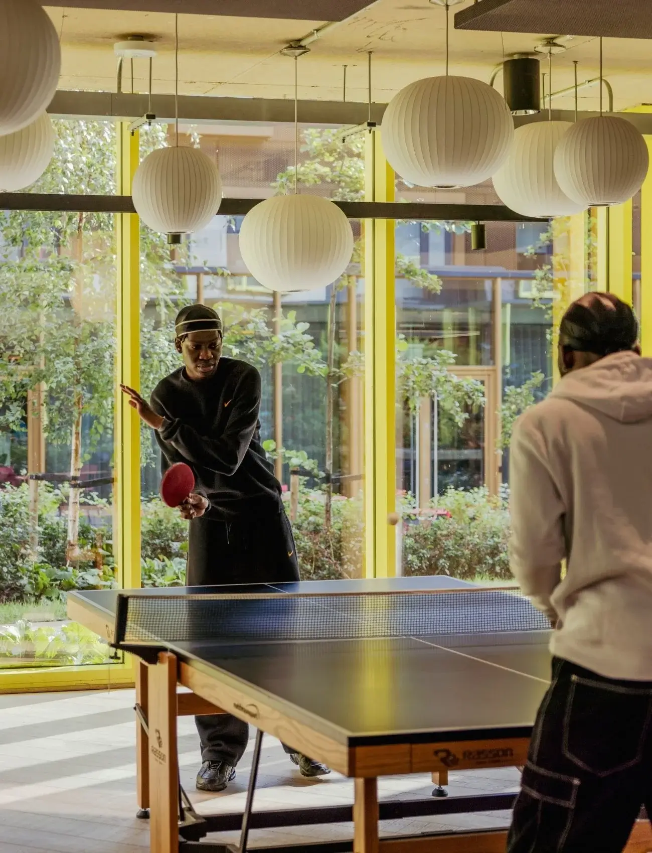 16 scape residents playing table tennis portrait