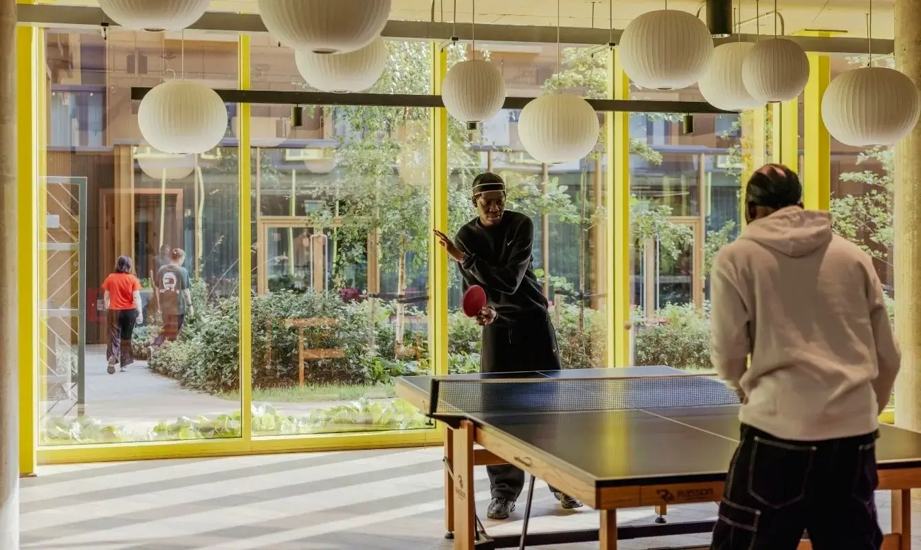 16 scape residents playing table tennis